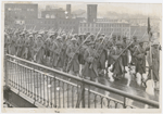 369th Infantry Regiment in march formation, crossing a bridge in New York City, circa 1917