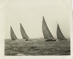 Close race between R class boats.