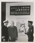 Artist Jacob Lawrence, with Coast Guard Captain Joe S. Rosenthal and photographer Carl Van Vechten, at his painting exhibition