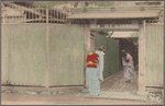 Women bowing to each other in entryway.