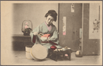 Woman dishing rice into bowl.
