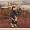 Oharame carrying furniture on head.