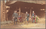 Rural people in front of barn.
