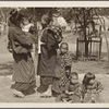 Woman with infant and children.