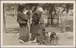 Woman with infant and children.