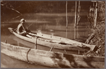 Fishing from a canoe.