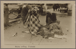 Malay selling pulasan.