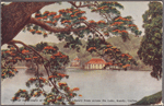 View of the Temple of the Holy Tooth and Library from across the lake, Kandy, Ceylon.