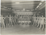 Chorus girls and other performers, as well as a stage prop resembling a railroad passenger car, at Connie's Inn, in Harlem, New York City, ca. 1920s