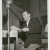 Publicity photograph of Herbert Marshall recording the radio program "The Man Called X."