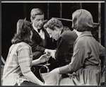 Alec Guiness [center] and ensemble in the stage production Dylan