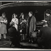 Alec Guiness [center] and ensemble in the stage production Dylan