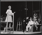 Judy Holliday [left foreground], Joseph Campanella [in dark suit], Howard Freeman [seated], George Furth [partly hidden behind Freeman] and unidentified others in the stage production Hot Spot