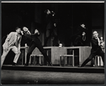 Tony Roberts [at left] and unidentified performers in the stage production How Now Dow Jones