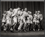 Tony Roberts [left foreground, wearing a tie] and unidentified performers in the stage production How Now Dow Jones