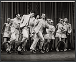 Tony Roberts [left foreground wearing a tie] and unidentified others in the stage production How Now Dow Jones