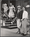 Rudy Vallee, Robert Morse and ensemble in the stage production How to Succeed in Business Without Really Trying