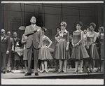 Rudy Vallee, Claudette Sutherland [center] and ensemble in the stage production How to Succeed in Business Without Really Trying