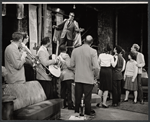 Dennis O'Keefe and ensemble in the stage production Never Live Over a Pretzel Factory