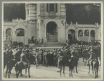 Crowd watching a theatrical performance on the front steps of a church.