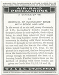 Removal of incendiary bomb with scoop and hoe.