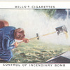 Control of incendiary bomb. (Pouring on sand from scoop).