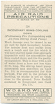 Incendiary bomb cooling down. (Preliminary fire extinguishing with jet from stirrup hand pump).