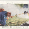 Control of incendiary bomb. (Pouring on sand from scoop).