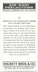 Removal of incendiary bomb with scoop and hoe.