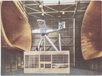 Aircraft suspended in wind-tunnel.