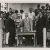 Geo. H. Walker, Pres. of the U.S. Golf Association, presenting cup to Chick Evans, Francis Ouimet at left.