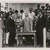 Geo. H. Walker, Pres. of the U.S. Golf Association, presenting cup to Chick Evans, Francis Ouimet at left.