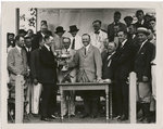 Geo. H. Walker, Pres. of the U.S. Golf Association, presenting cup to Chick Evans, Francis Ouimet at left.