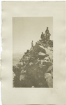 Group of mountain climbers on a peak.