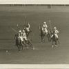 Polo : two players competing for the ball.