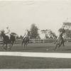 Three polo players approaching sideboard.