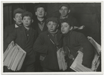 Group of newsboys starting out at Brooklyn Bridge early Sunday morning