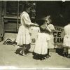 Four children on a sidewalk, New York City
