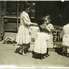 Four children on a sidewalk, New York City