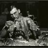 Glass worker making laboratory equipment in a Millville, New Jersey glass works