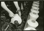 Close-up of hands of 'winder operator' in a N.C. cotton mill, showing how broken threads are tied more rapidly than by hand