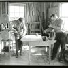 Two carpenters building a dining room table