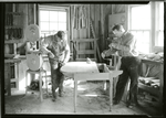 Two carpenters building a dining room table
