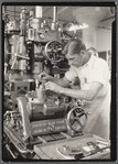 Precision mechanic using depth gauge on a metal boring