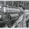 Adolescent girl spinner in a cotton mill