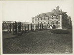 View of garden with trellises adjoining Ellis Island building.