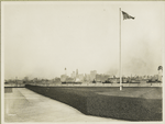 View of the New York skyline from Ellis Island. The Woolworth Building (the tallest building, at left) is under construction, which dates the photograph as c. 1912-13.