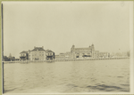 Another view of Ellis Island from the harbor, but showing a front view of the Immigration Station.