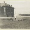 View of fountain in garden adjoining Ellis Island building.