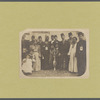 A group of immigrants, most wearing fezzes, surrounding a large vessel which is decorated with the star and crescent symbol of the Moslem religion and the Ottoman Turks